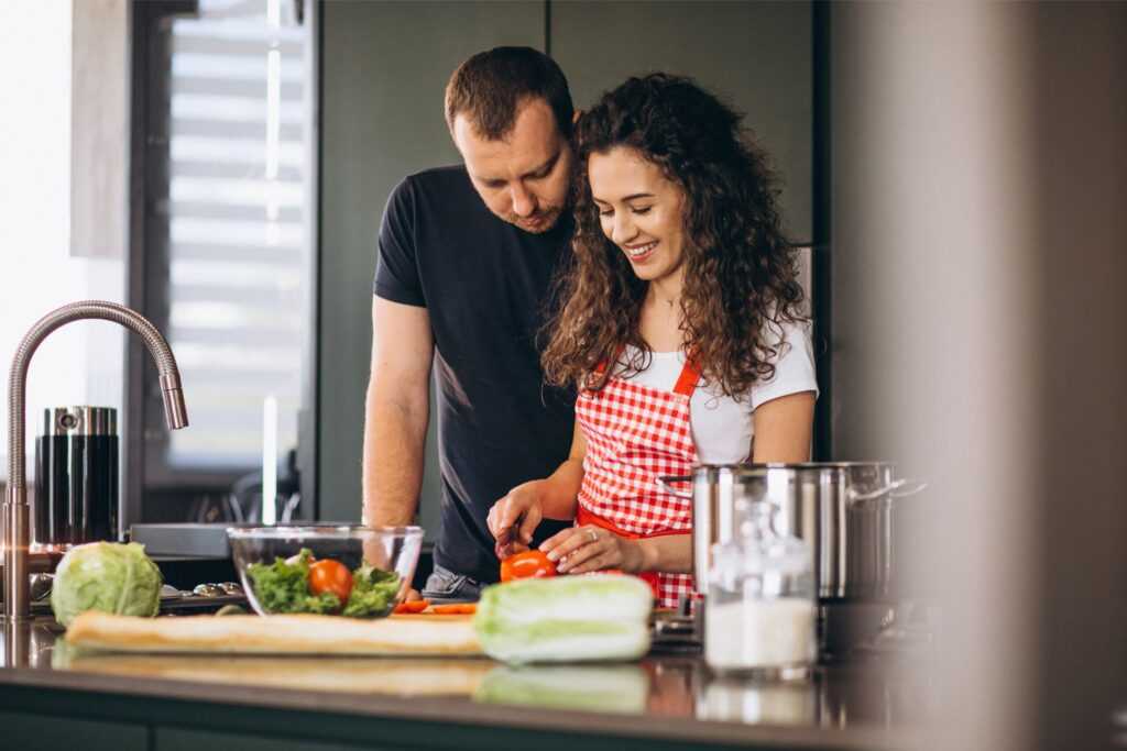 young couple cooking together kitchen